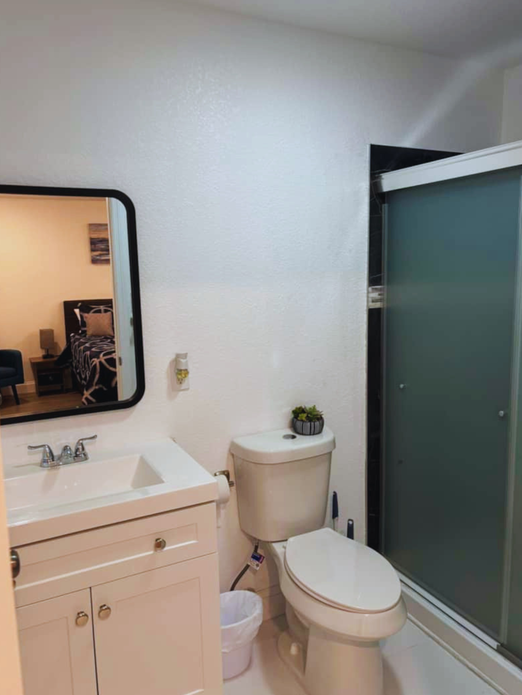 Spotless bathroom with mirror, toilet, shower, and essential amenities. Lakeland, FL Spotless bathroom with mirror, toilet, shower, and essential amenities. Lakeland, FL