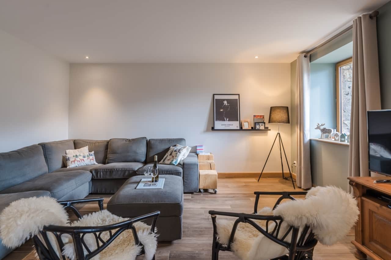 Cozy TV lounge with corner sofa, 45" screen offering Netflix, Prime, Disney+ and Chromecast.