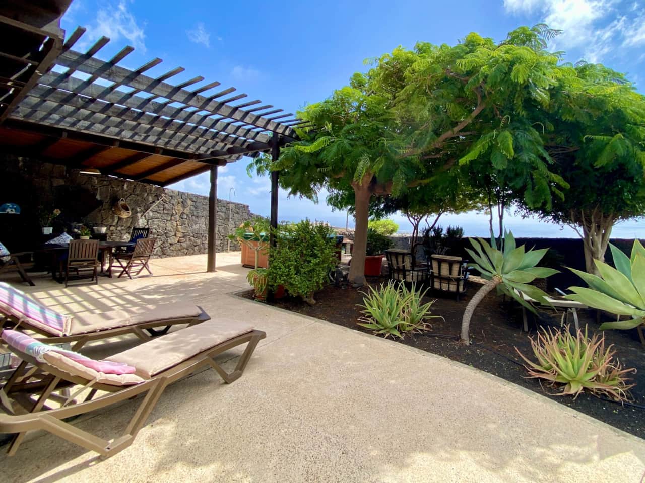 Loungers on terrace of finca Casa Tabobo