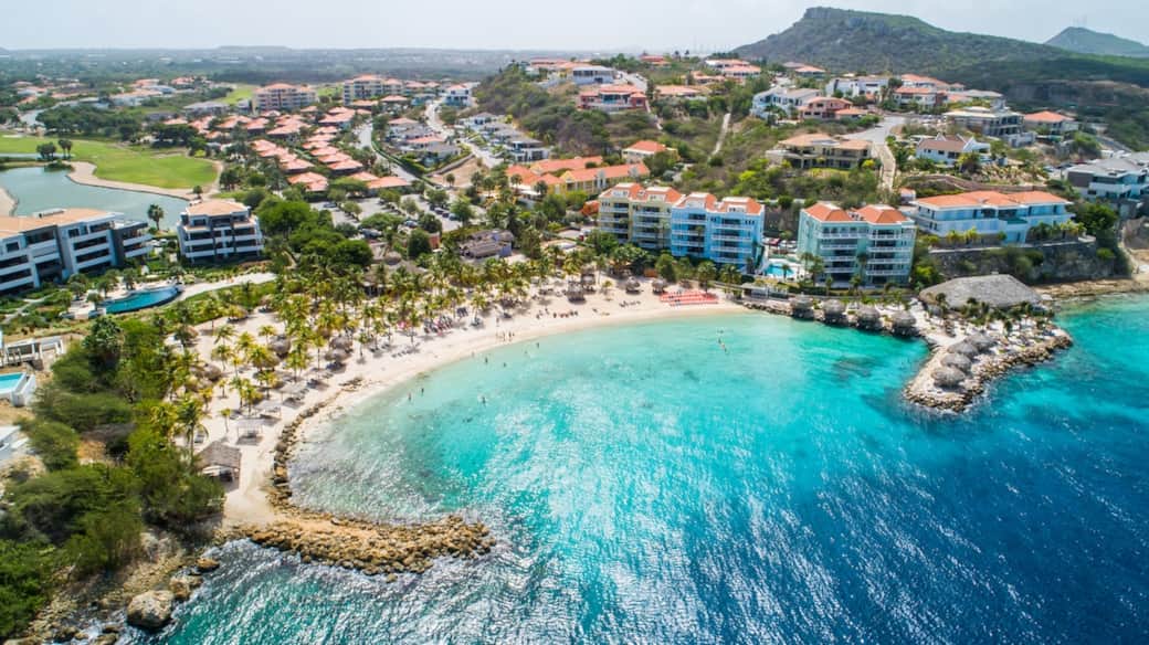 The beach with the Ocean Suites on the right. Ocean Suite 13 is on the 2nd floor, blue building.