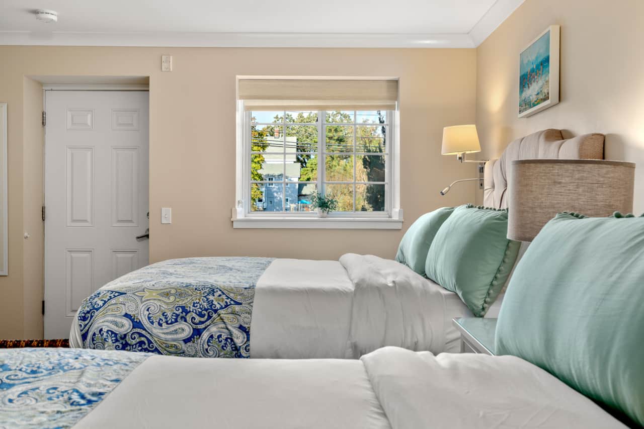 Two queen beds, clean linens, and a private entrance