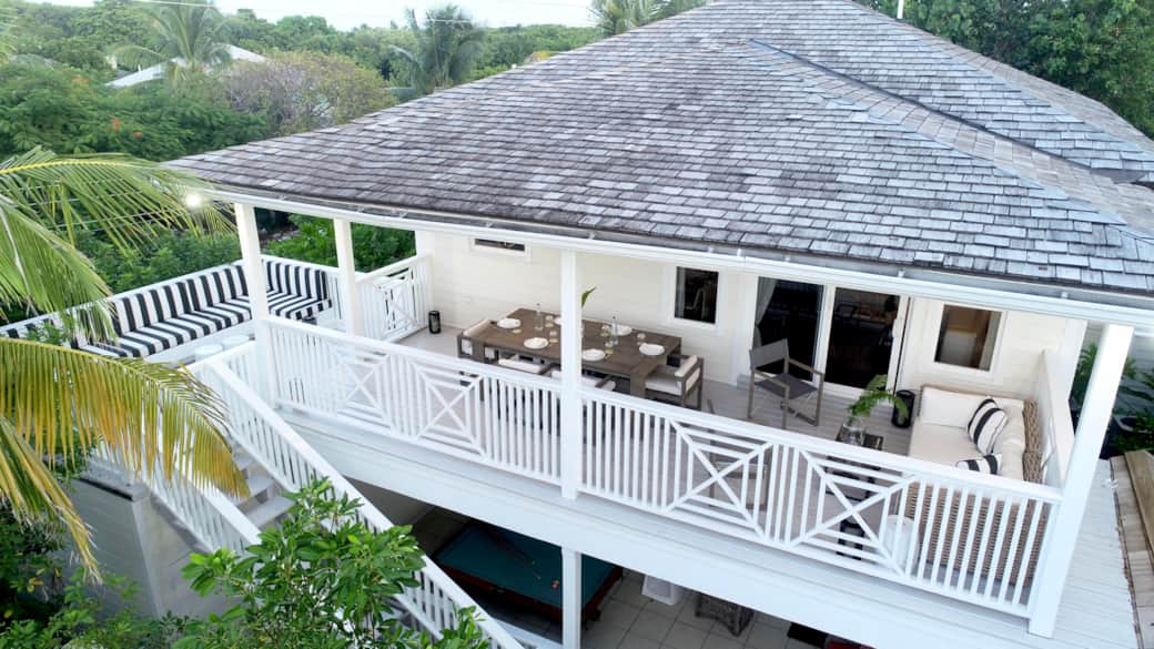 Upper-level covered deck at The Hideaway on Colebrooke Street with sea glimpses