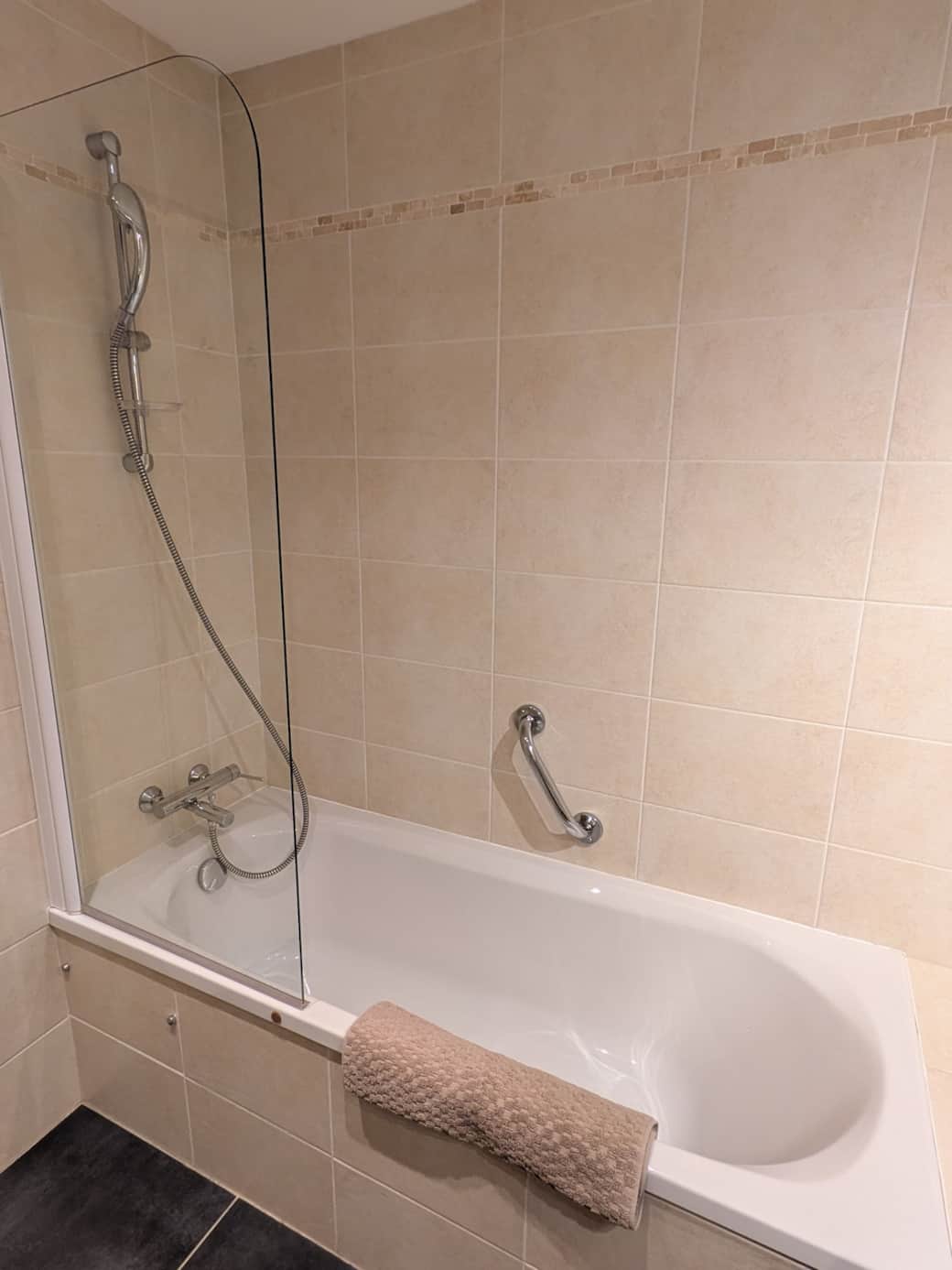 The bathroom is equipped with a large bathtub.