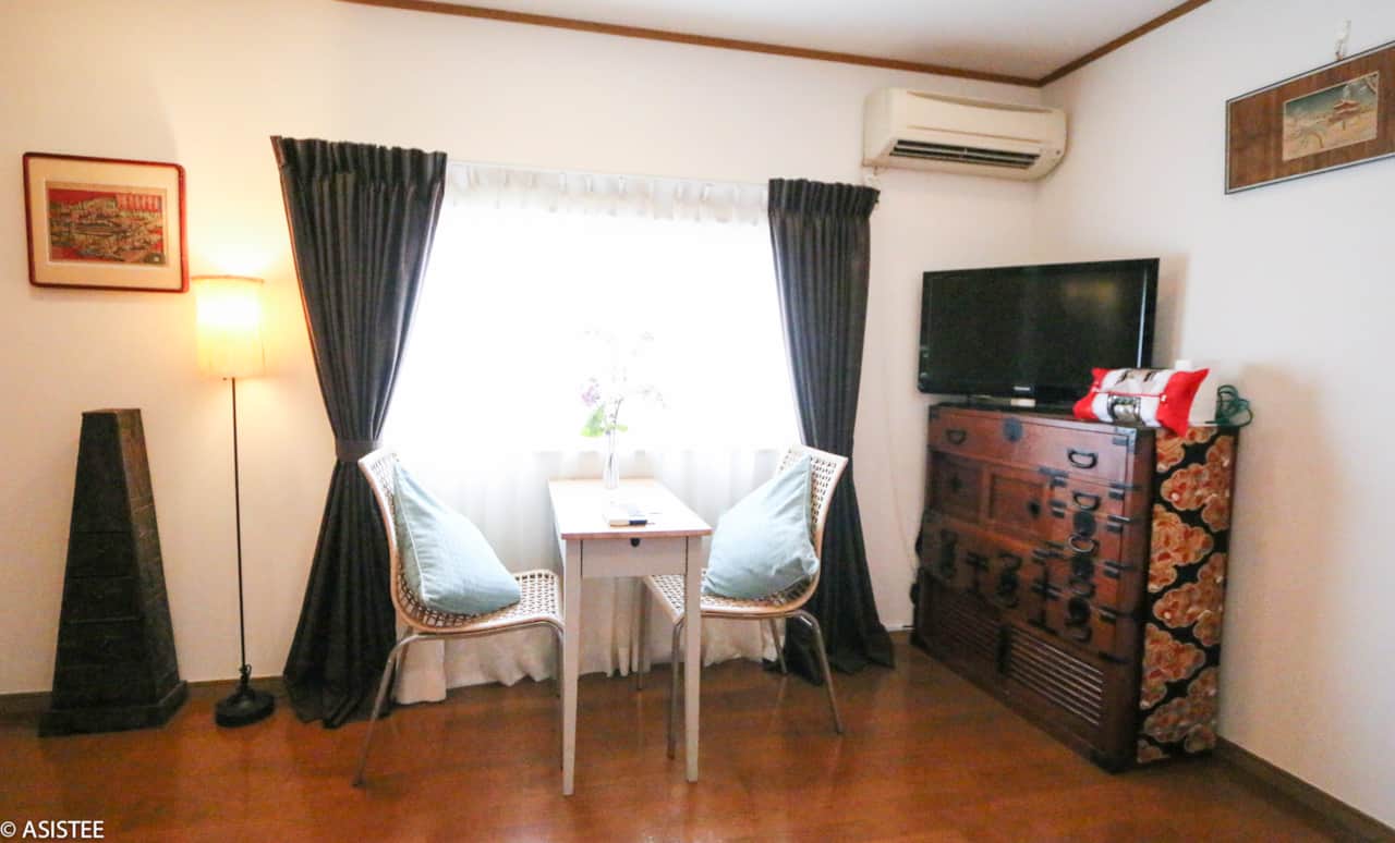 Enjoy meals or work from this bright window nook, perfectly paired with cultural furnishings.