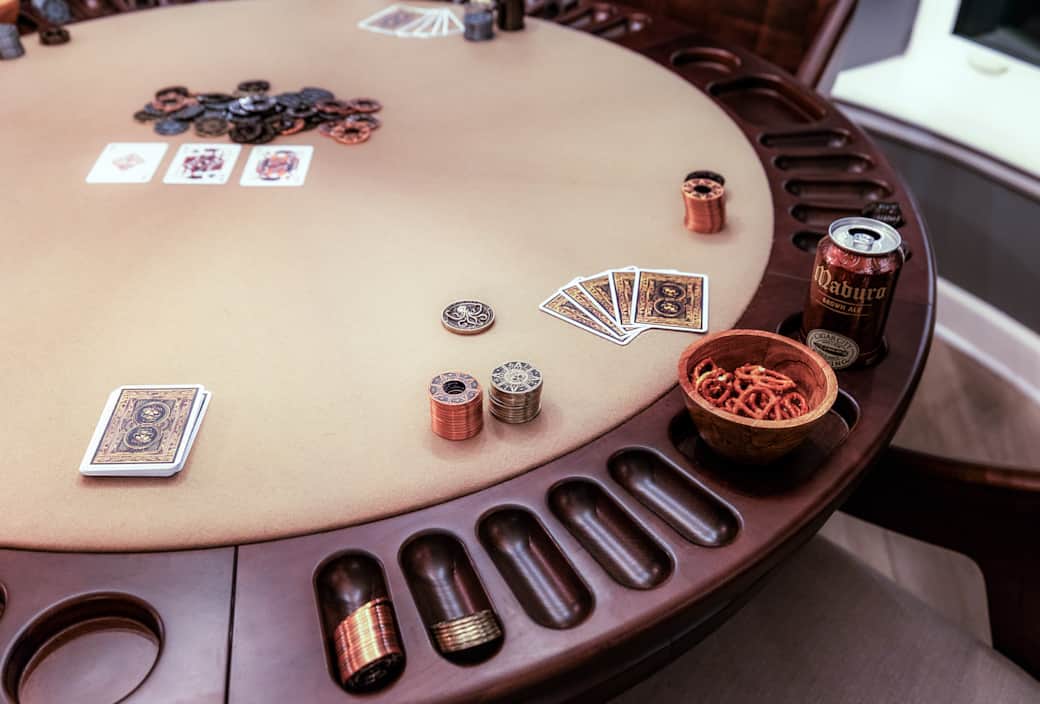 Daytime poker setup in the casual dining nook, featuring a pirate-themed chip set. Daytime poker setup in the casual dining nook, featuring a pirate-themed chip set.