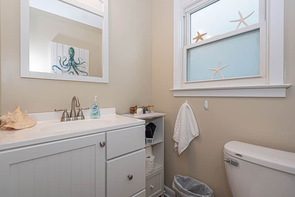 Full bathroom, with cabinet storage
