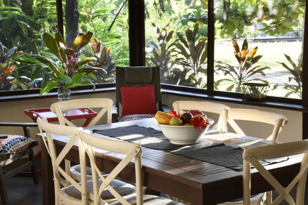 Lillypads Red Cottage - Veranda dining - view to tropical gardens