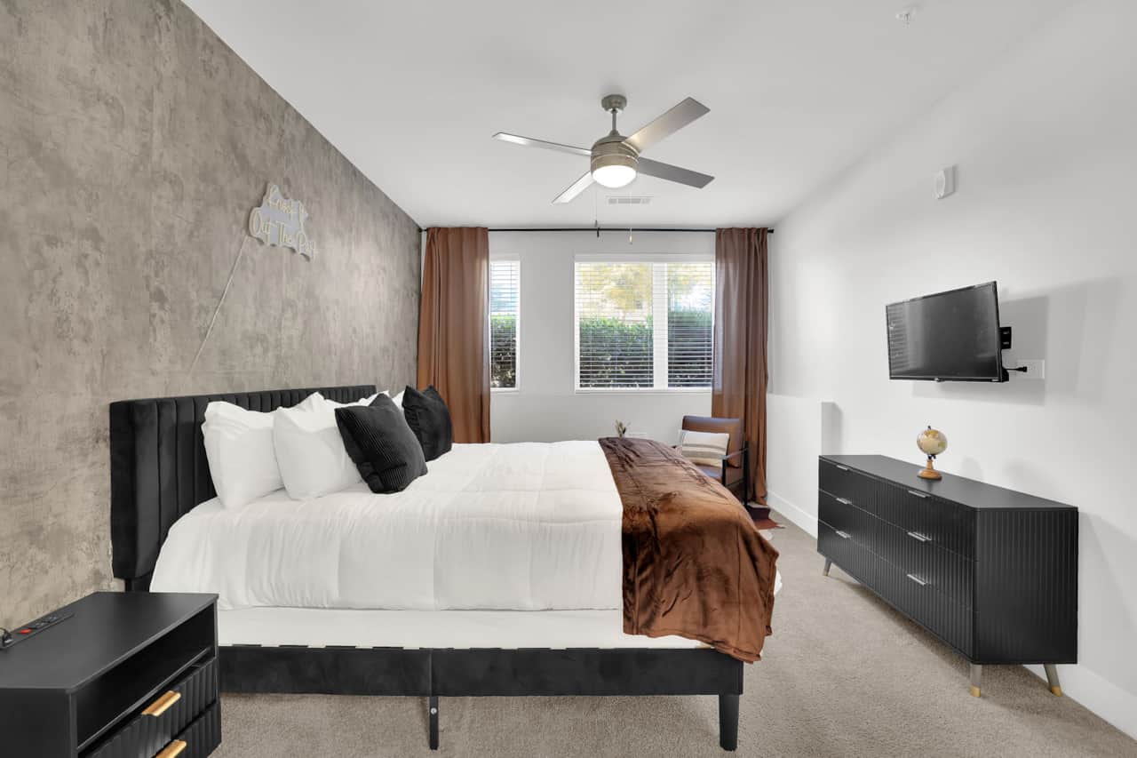 Primary Bedroom features a King Sized bed, Smart TV with High Speed Wifi, and Reading Area.