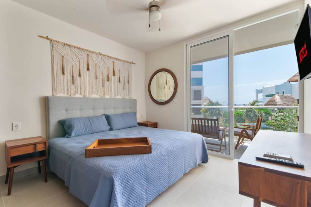 Relax in the master bedroom with stunning Caribbean ocean views and your own private balcony.