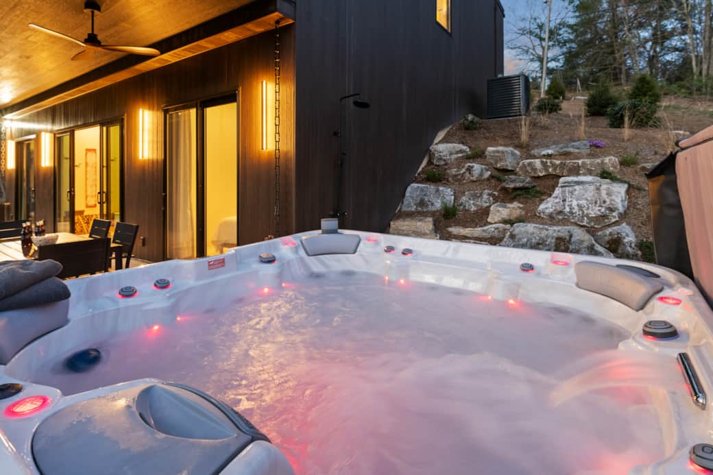The hot tub seats 7. The boulder wall seats 10. You bring the stories.