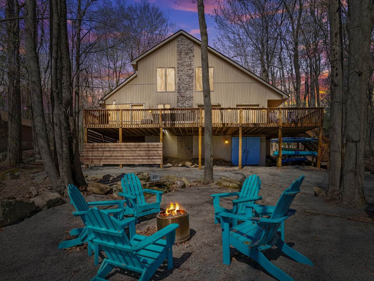 Enjoy the solo stove under the stars in a serene wooded setting.  Six new Durogreen Adirondack chairs with side tables.  Nine Adirondack chairs in total on the property.