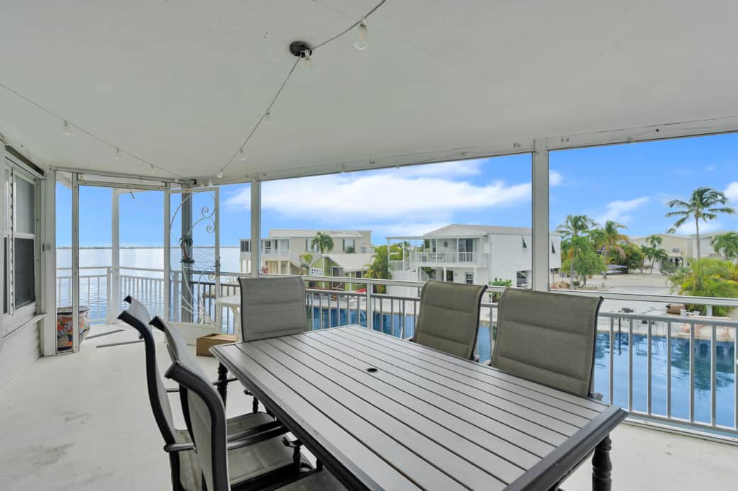 Canalside screened patio seating area