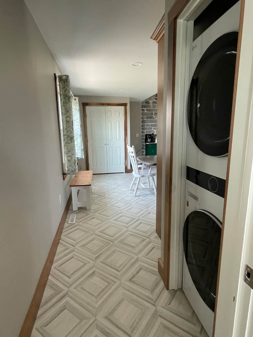 Washer and dryer is downstairs off of the kitchen. Laundry detergent, iron, clothes rack and cleaning supplies for spills are in the closet straight ahead. Extra chairs are also available if needed.