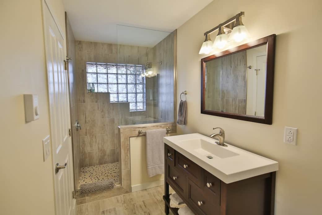 Bathroom with large walk in tiled rain shower Bathroom with large walk in tiled rain shower