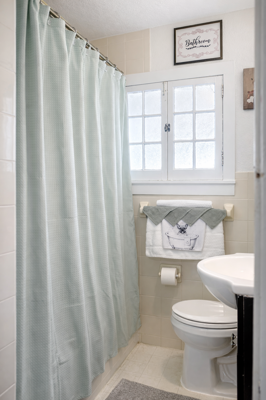 Well-appointed full bathroom with tub, hand shower, and upscale essentials