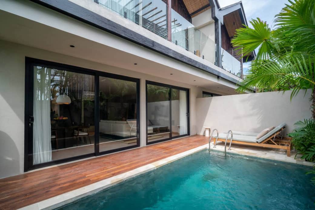 Compact private pool surrounded by greenery, and two sunbeds. Compact private pool surrounded by greenery, and two sunbeds.