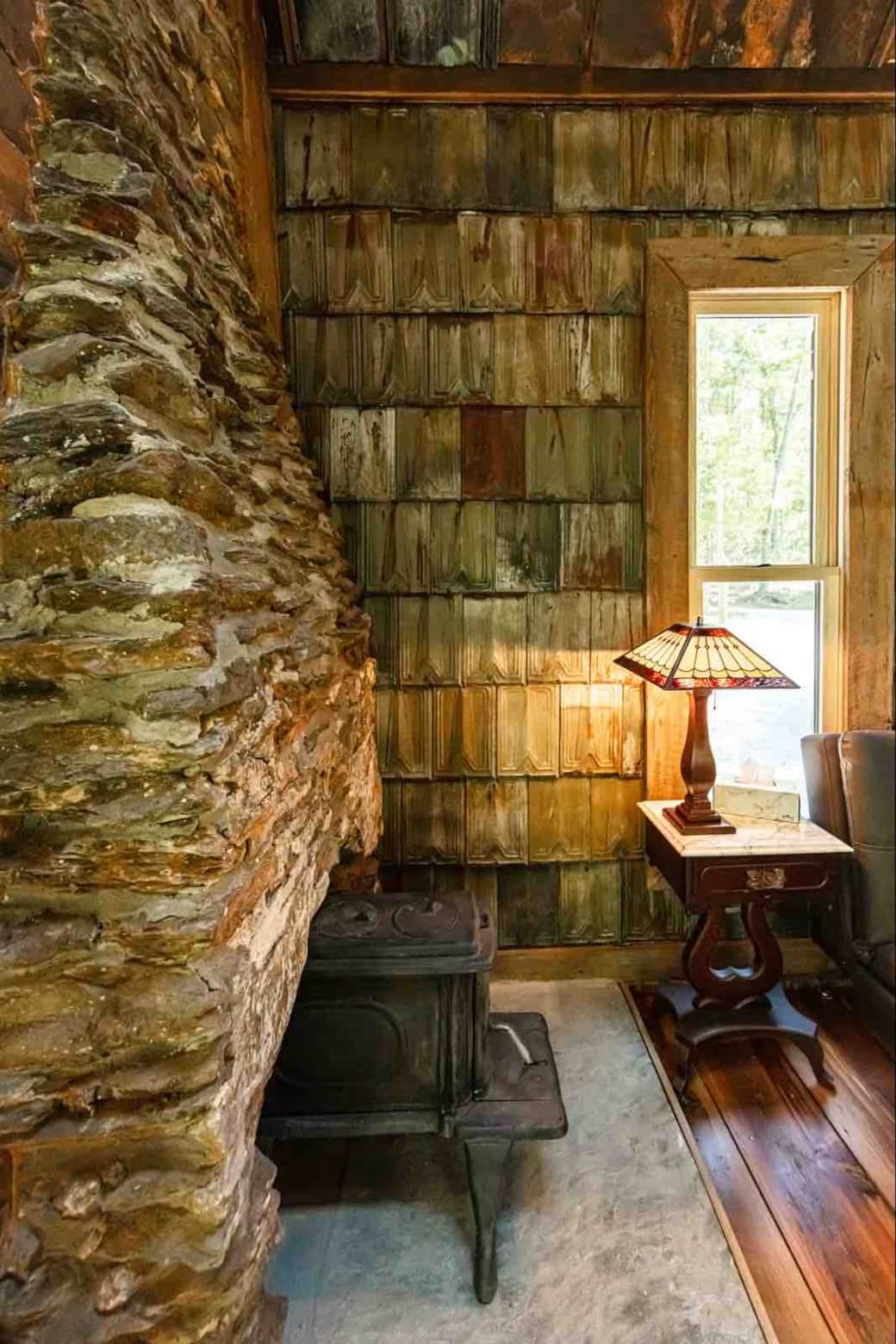 We have a wood burning stove on a bluestone hearth pad.   The wall is clad in 130 year old Victorian metal roofing tiles (salvaged from an old house nearby.) This photo is a study in texture.