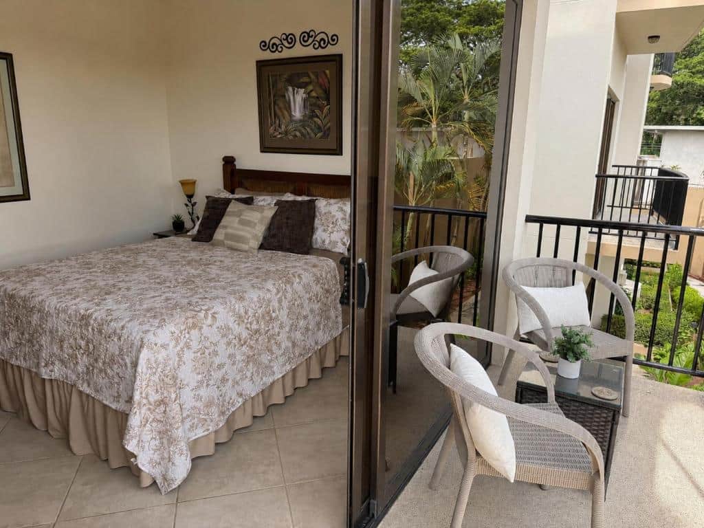 Bedroom with queen bed, balcony and sitting area | Monaco Condominiums Jaco, Costa Rica Bedroom with queen bed, balcony and sitting area | Monaco Condominiums Jaco, Costa Rica