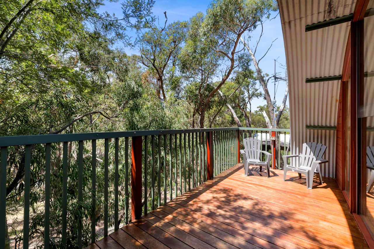 Escape to our charming two-bedroom cottage in an idyllic bush setting for a memorable stay.