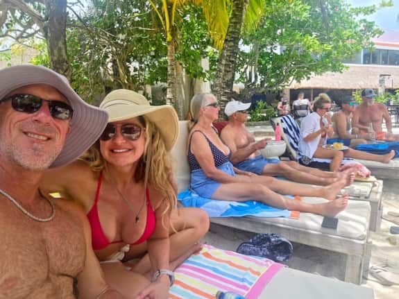 Friends relaxing together during a beach club day in Cozumel