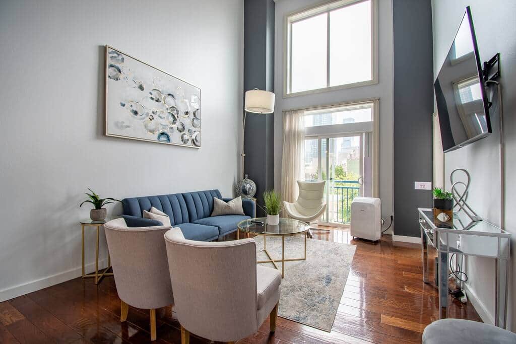 Living Room with a Large TV, Vaulted Ceiling Windows & Sleeper Sofa