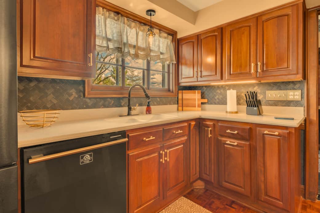 Kitchen has a dishwasher and disposal