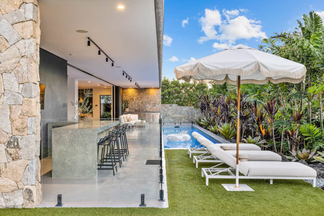 Stone topped alfresco bar with outdoor TV and bar fridge