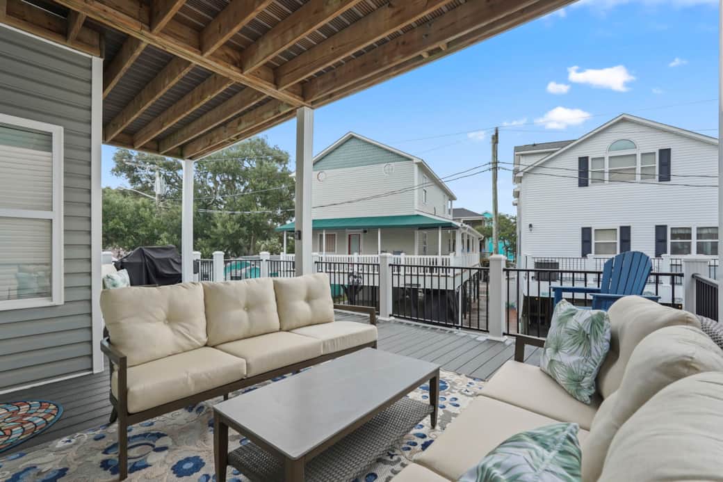 Sink into the shaded deck lounge — the sofa everybody fights over at sunset Sink into the shaded deck lounge — the sofa everybody fights over at sunset