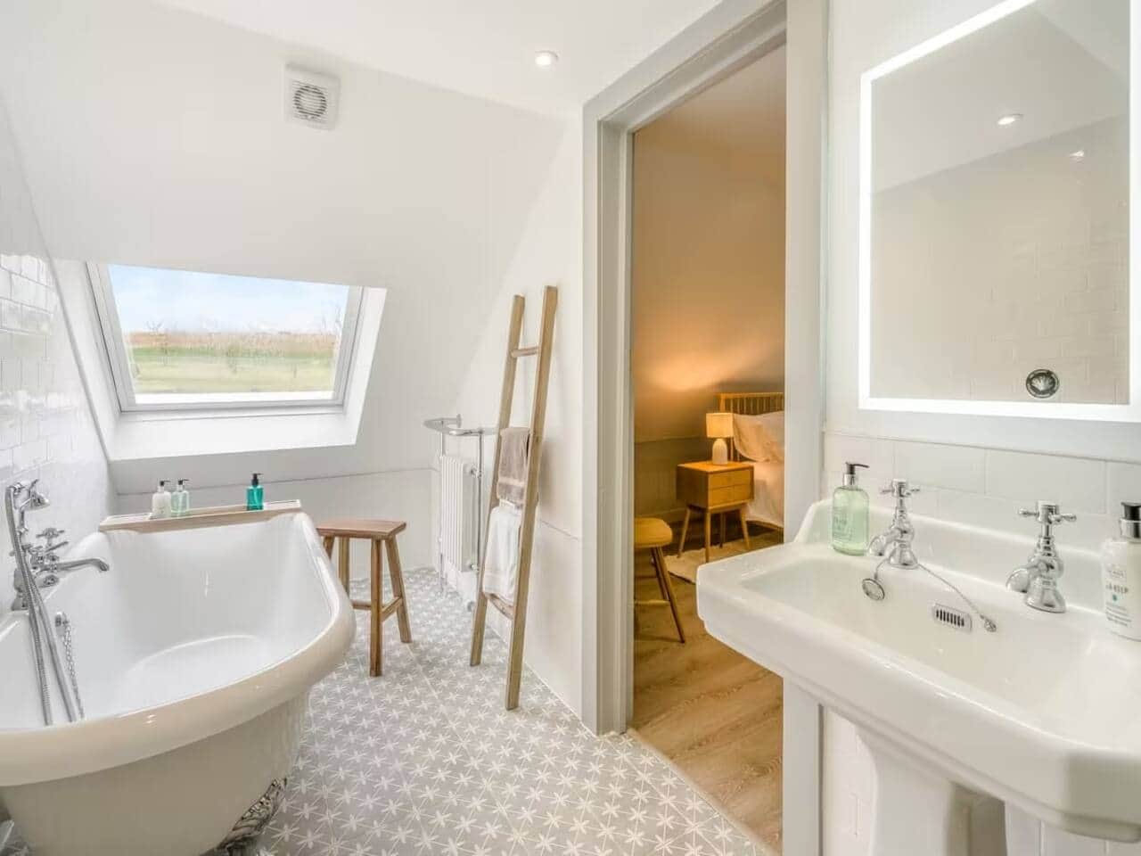 Large roll top bath with skylight luxury fixtures Ayrshire