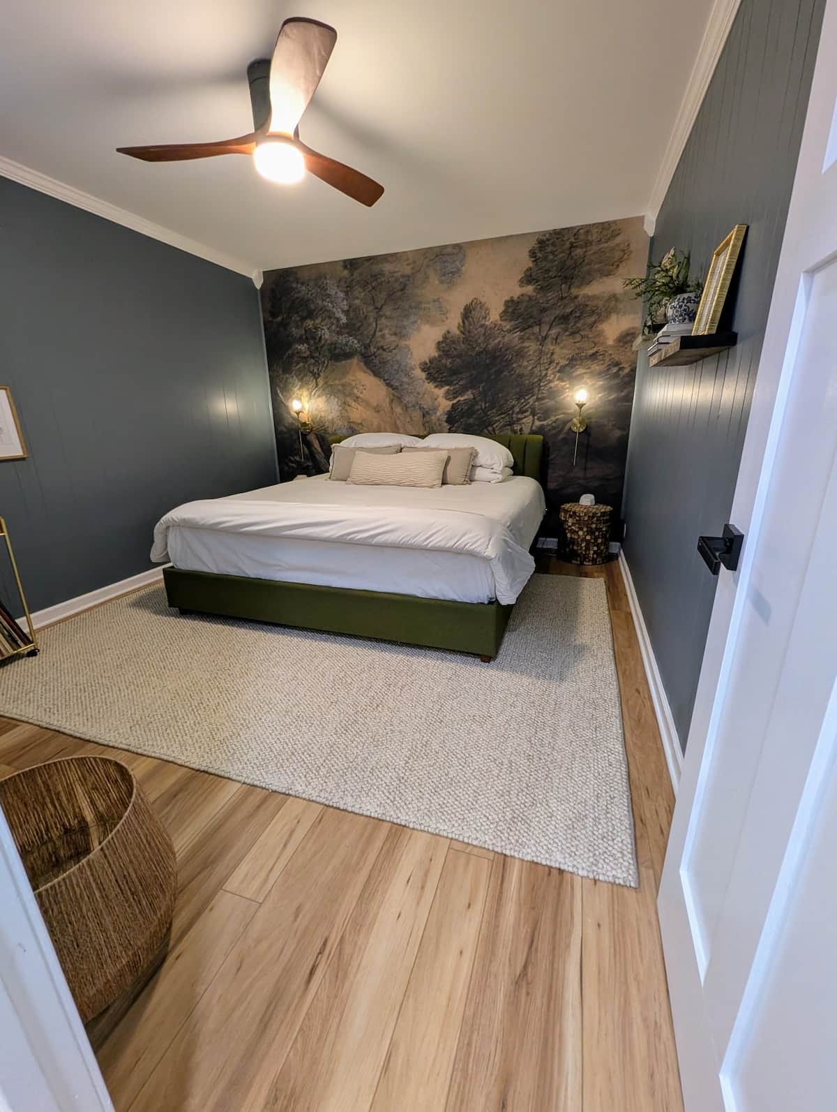 Sink into a cozy king bed in this moody, inviting retreat. Thoughtfully styled for comfort, the room features a spacious closet and warm, relaxing ambiance—perfect for unwinding after a day of exploring.