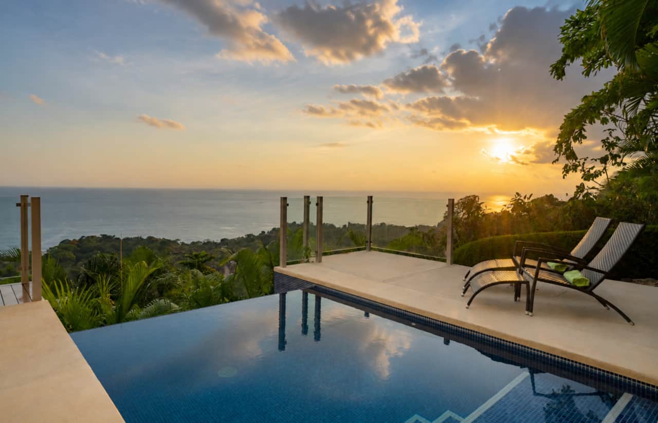 Golden Pacific sunsets reflected across your private pool above the tropical rainforest.
