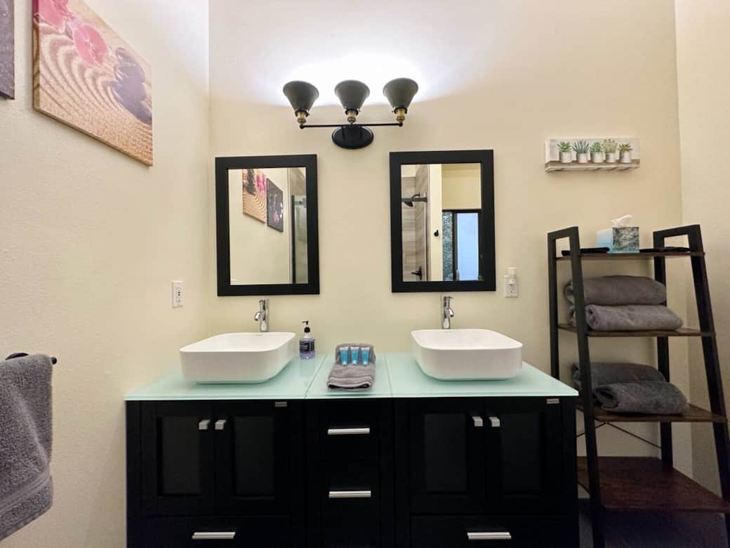 Penthouse Cottage: Bathroom with double sink vanity and designer shower.