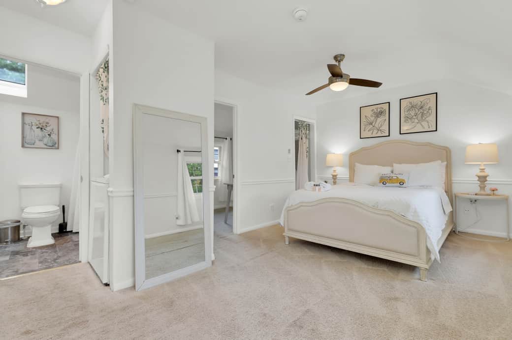 Upstairs featuring queen bed, office, closet, and full bathroom