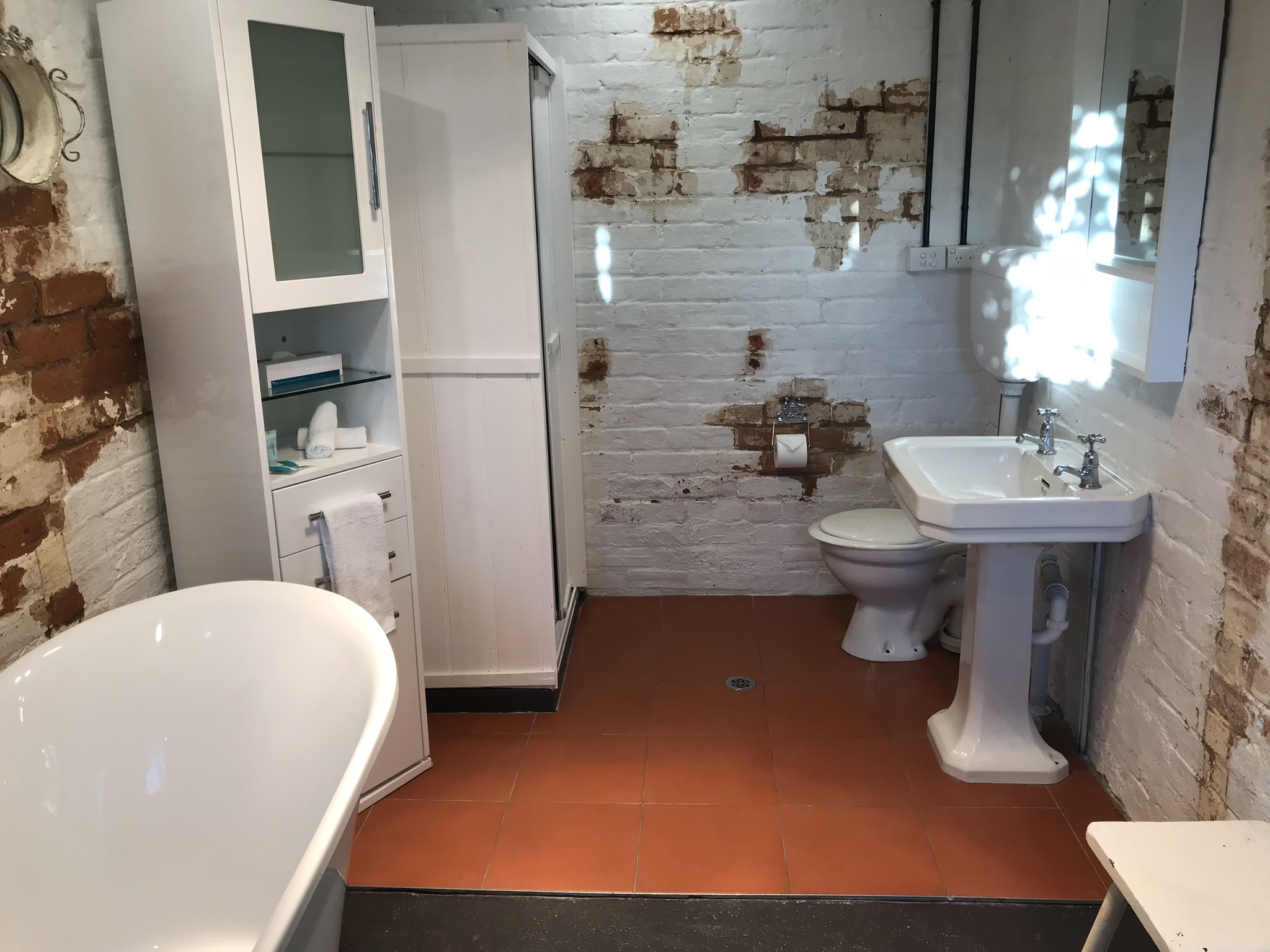 Bathroom with clawfoot bathtub and shower