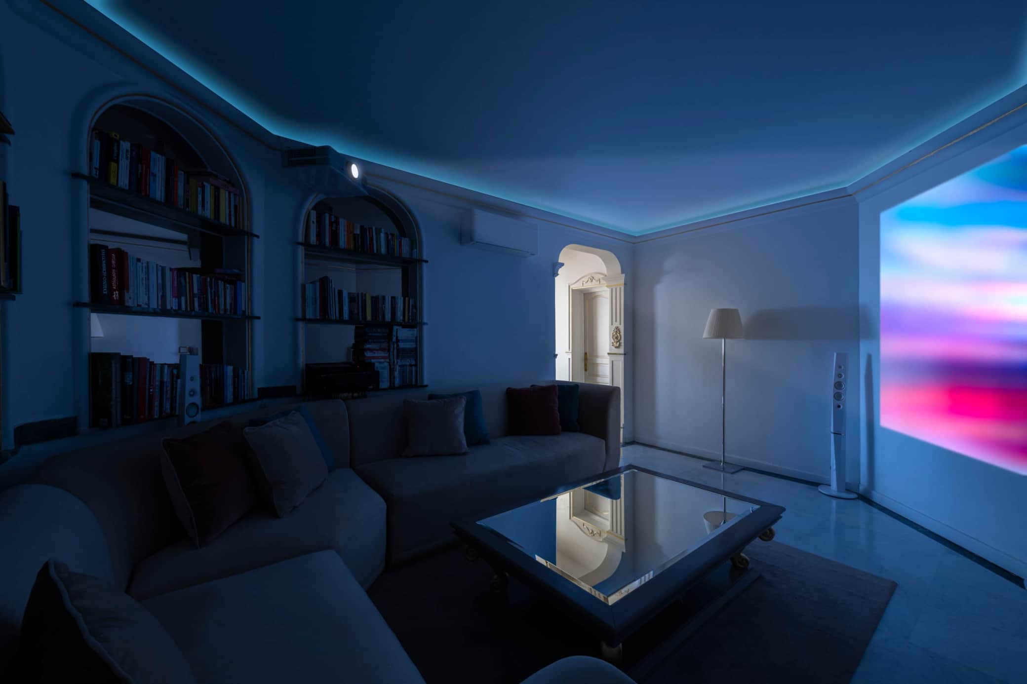 Home cinema with projector and library
