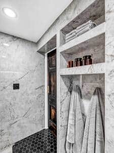 Built-in bathroom shelving and towel hooks