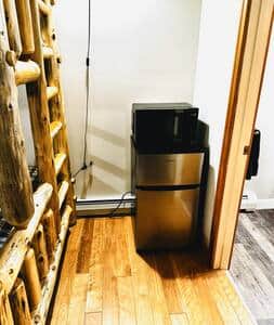 Kitchenette includes dorm sized fridge and microwave