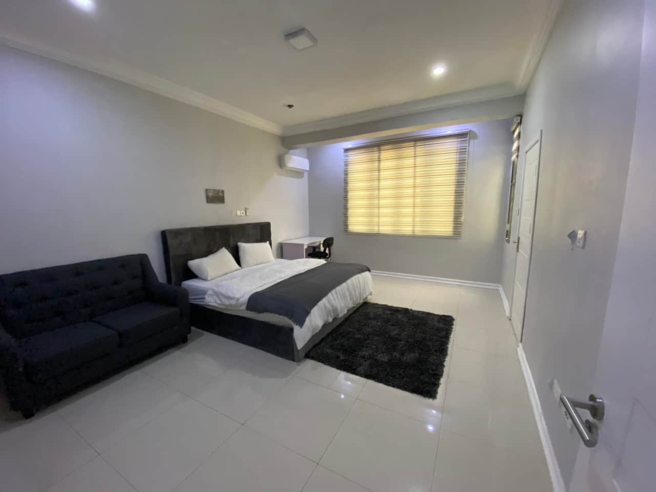 The master bedroom boasts a comfy king size bed