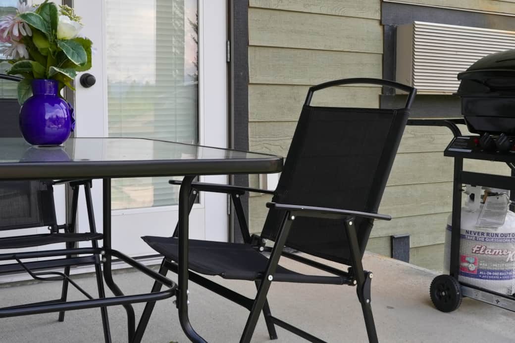 Walk out balcony with BBQ and green space
