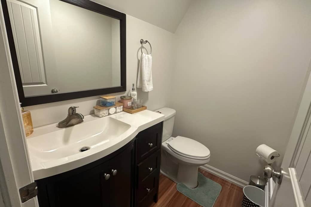 Private ensuite bathroom with a stylish vanity, guest essentials, and a tidy, welcoming setup.
