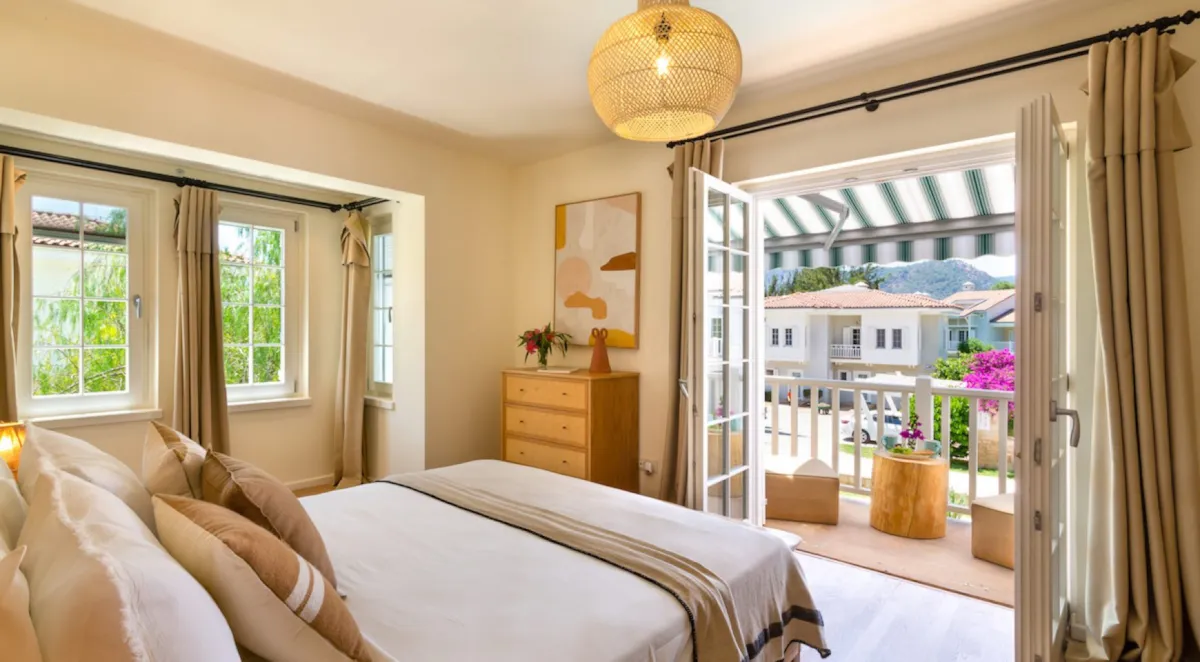 Bedroom with a double bed, dresser, and balcony access, Portville B2 044, Gocek.