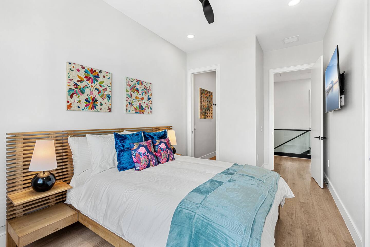 Bedroom 7 features a comfortable queen size bed and a TV.