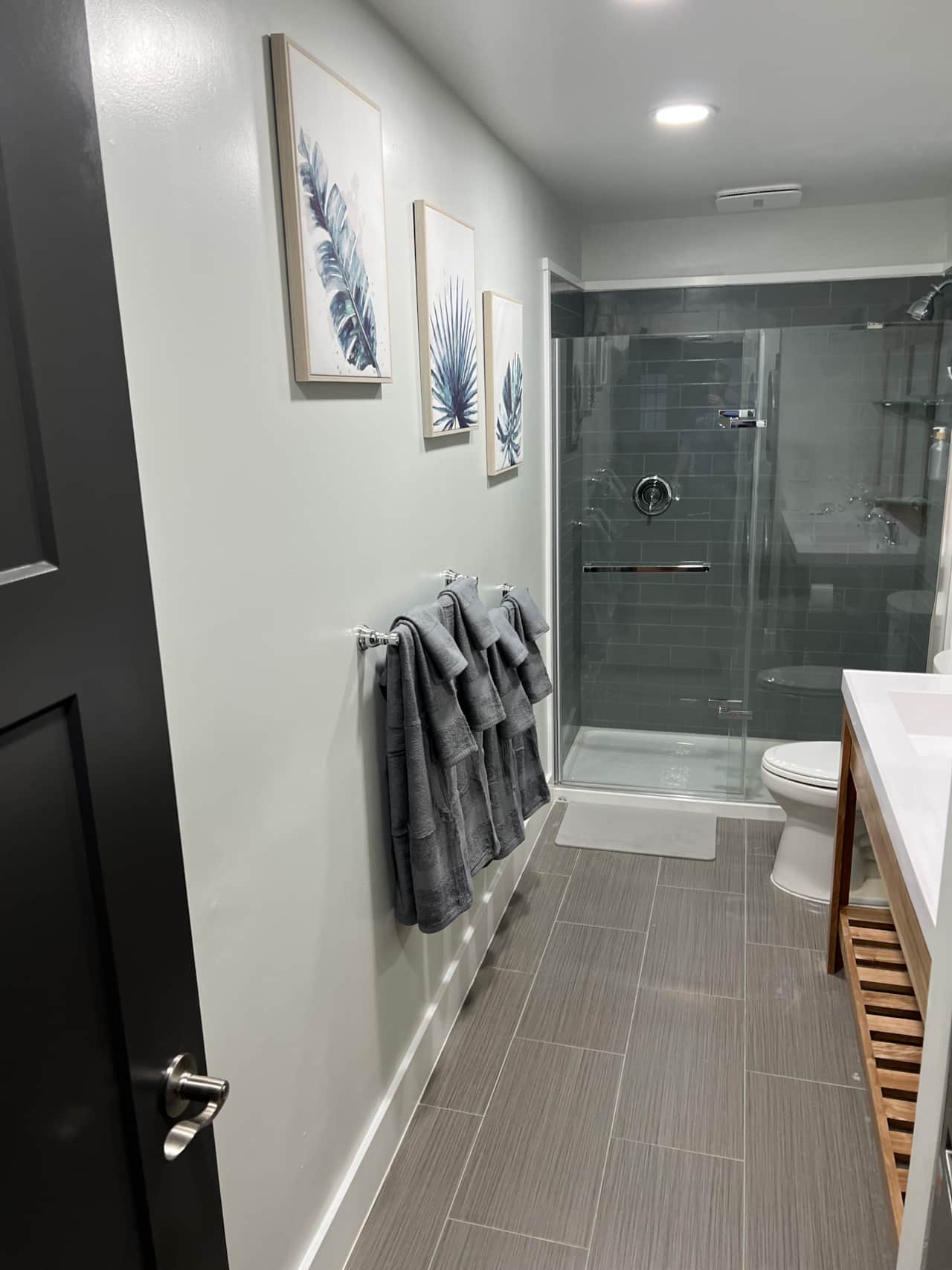 Guest bathroom with dual sink, and in unit laundry