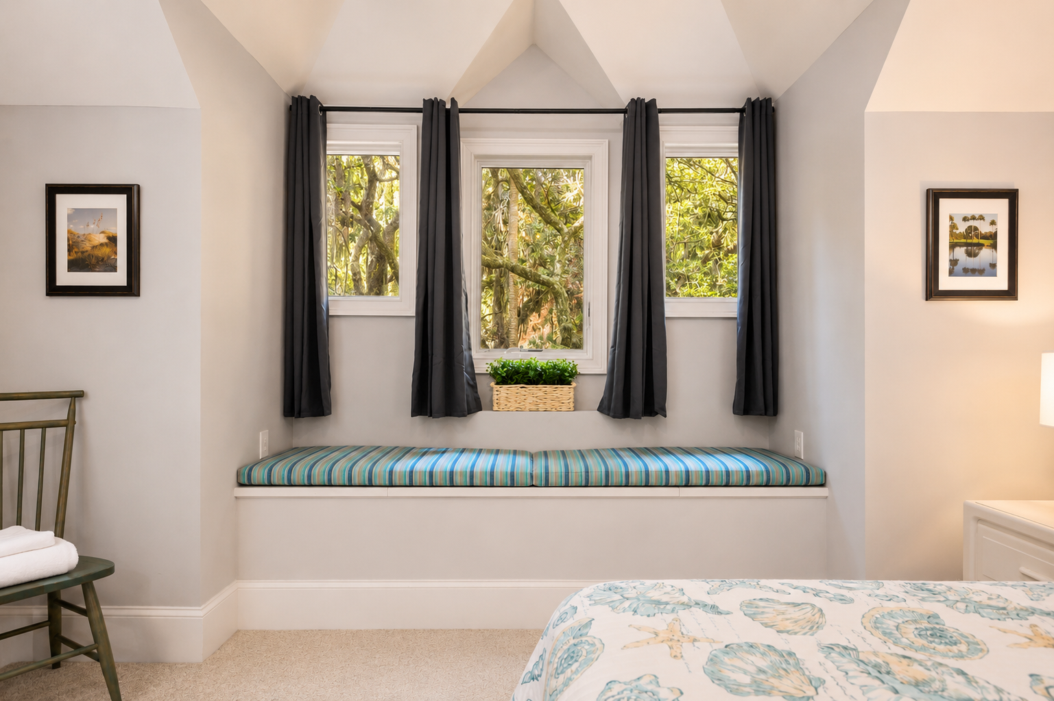 Grab a book and stretch out on the striped bench with treetops in view.