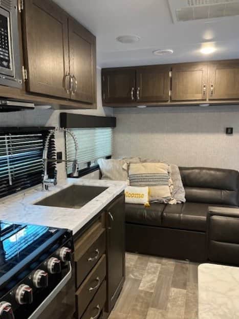 inside kitchen sink and main area couch