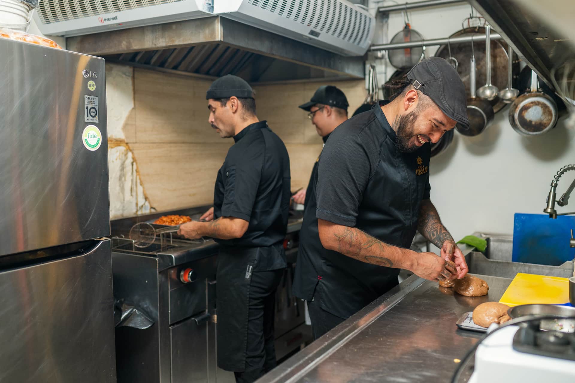 Chefs preparing gourmet dishes in Villa TuluMar kitchen