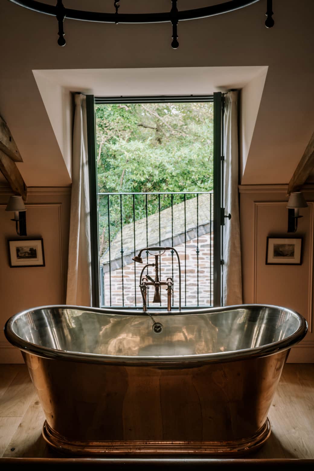 The Master Bedroom Copper Bath and Juliet Balcony.  Photo credit: Amy Heycock