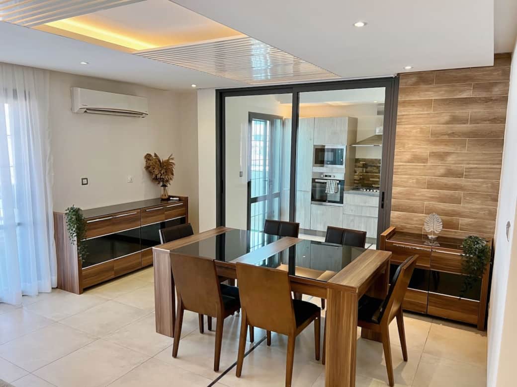Savor memorable moments in our cozy dining area, where earthy tones and textured details set the stage for shared meals and cherished conversations.