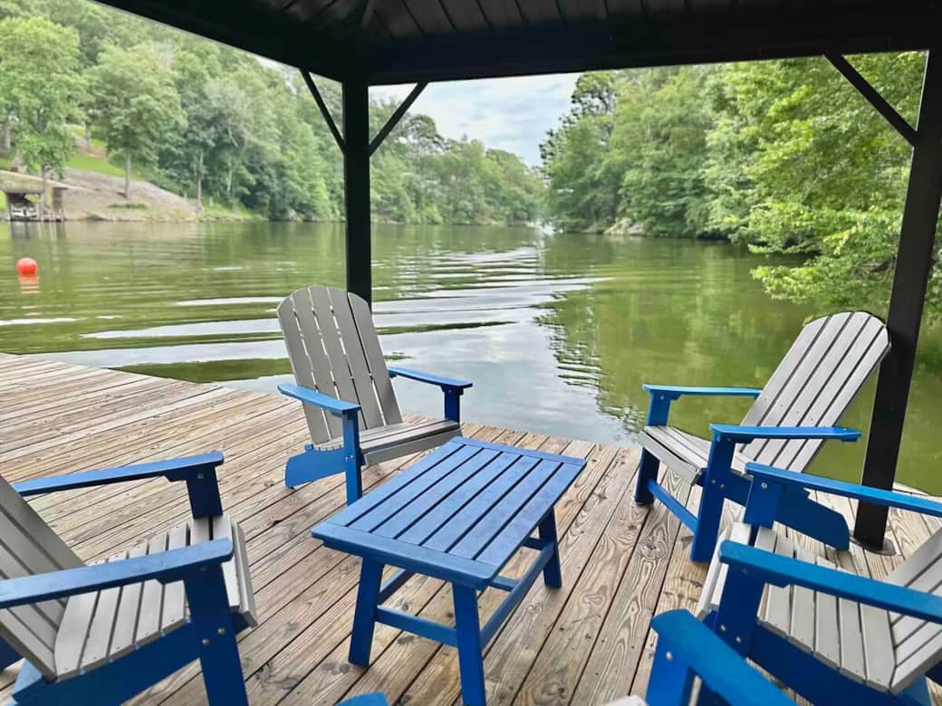 Shaded comfort under the covered pergola — 4 lakeside chairs on the private dock.

covered pergola, private dock, secluded cove, lakeside seating, deep crystal-clear water, swimming, shaded dock, Smith Mountain Lake.