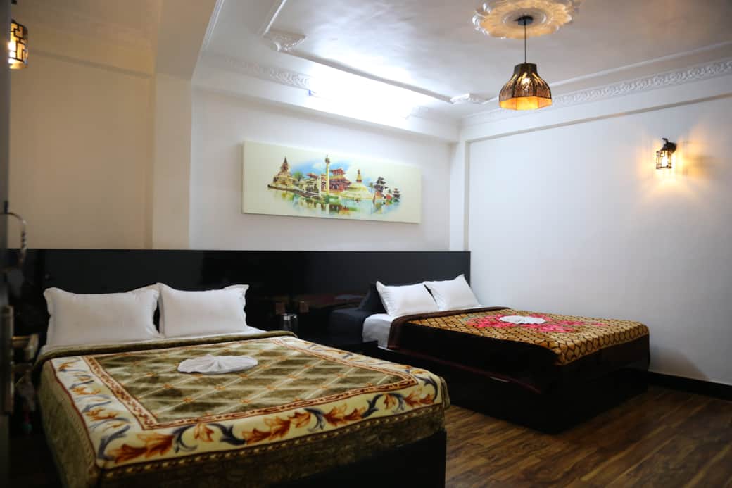 “Two comfortable queen beds for up to 4 guests, with air conditioning and a cozy, spiritual ambiance.”